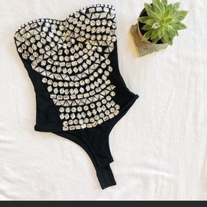 Black bodysuit with crystal look alike plastic stones.